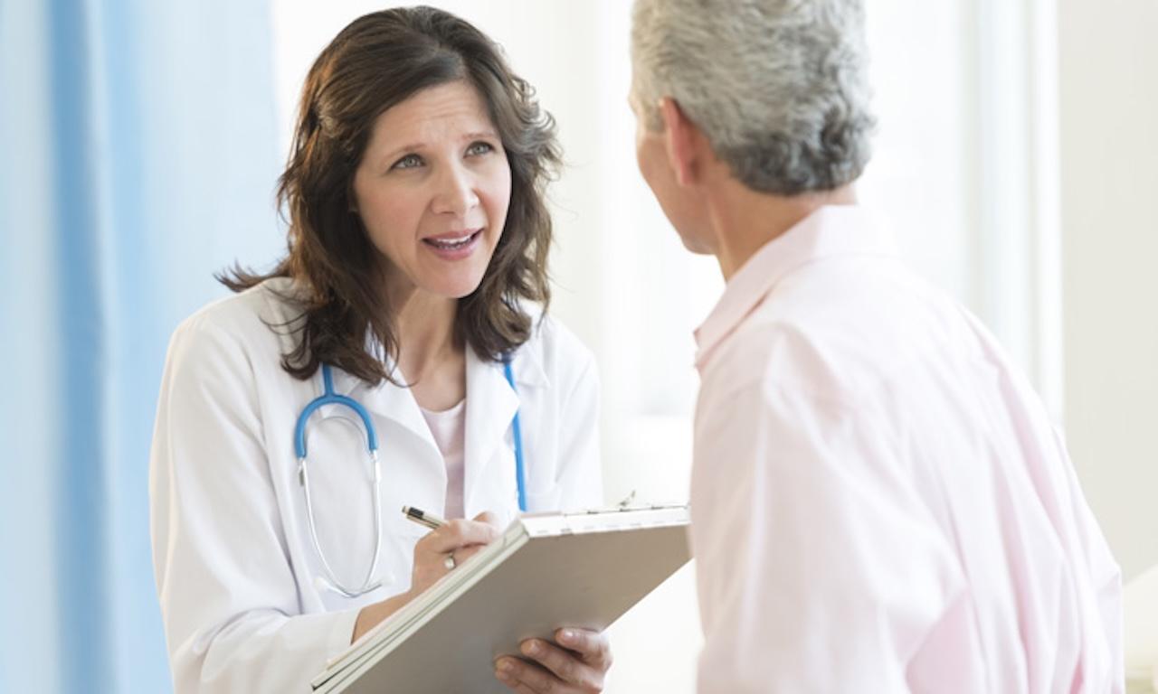 female doctor speaking to male patient