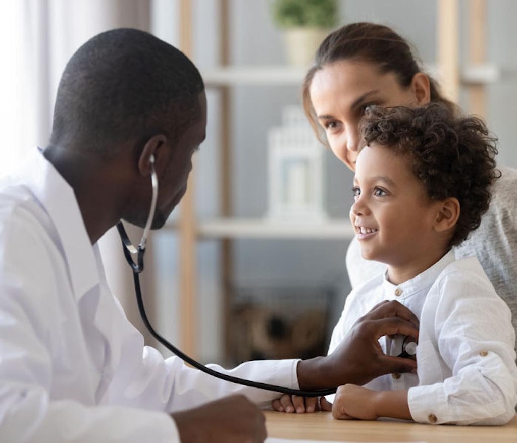 pediatrician listening with a stethoscope