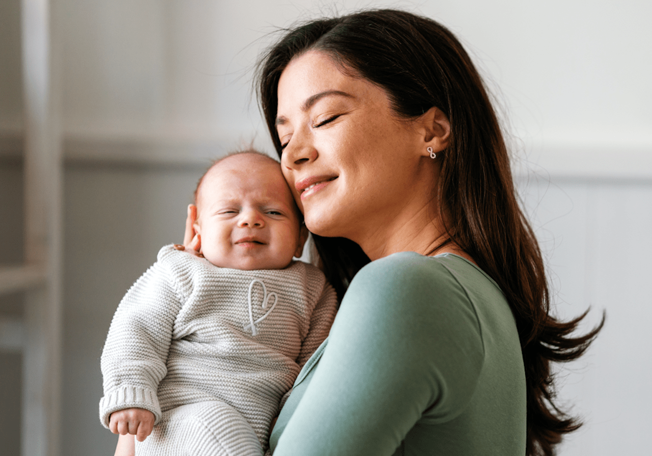 asian woman holding baby